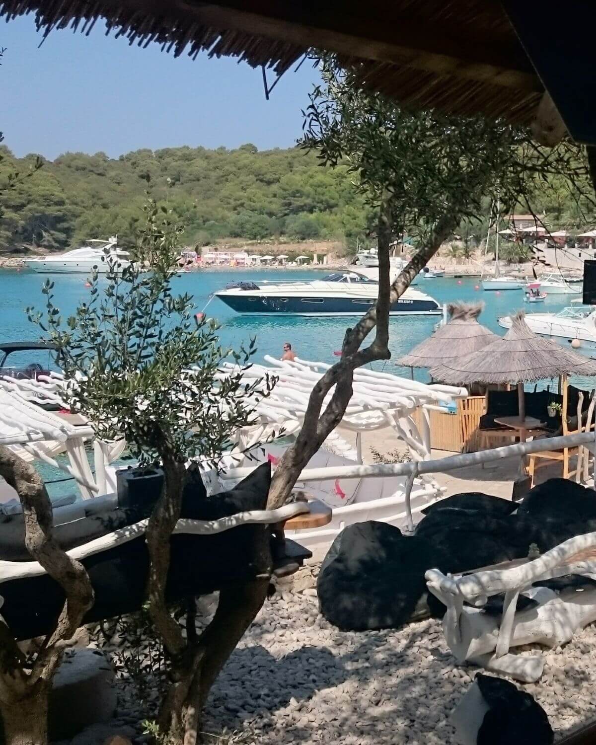 Relaxed beach club stop during private boat tour in Croatia