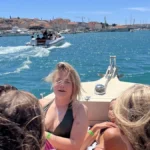Guests enjoying a private boat tour from Kaštela, Croatia while deciding between a half-day and full-day boat tour.